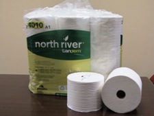 Pack of toilet paper with North River branding wrap, 2 loose rolls in front